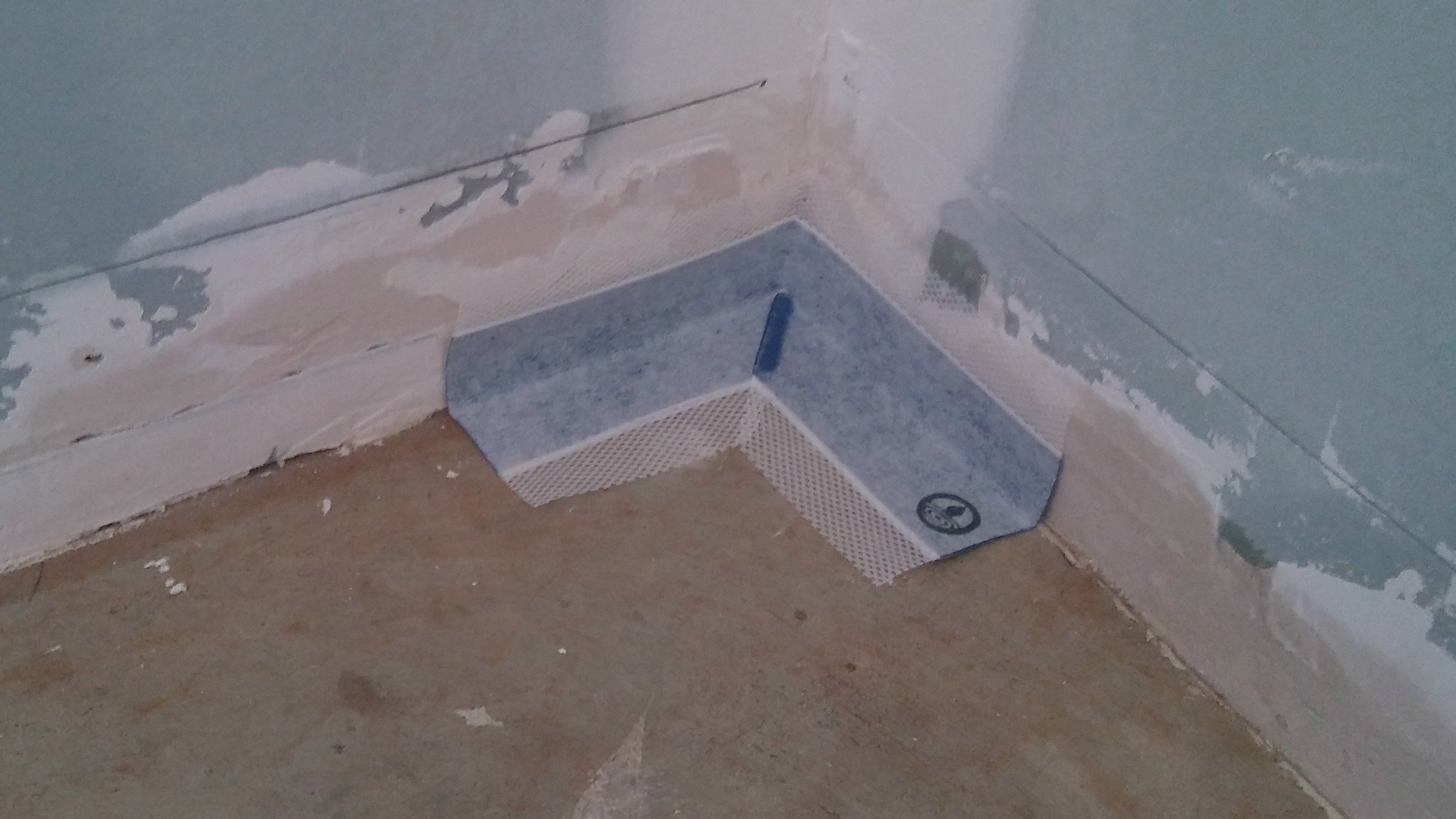 shower floor waterproofing corner pocket