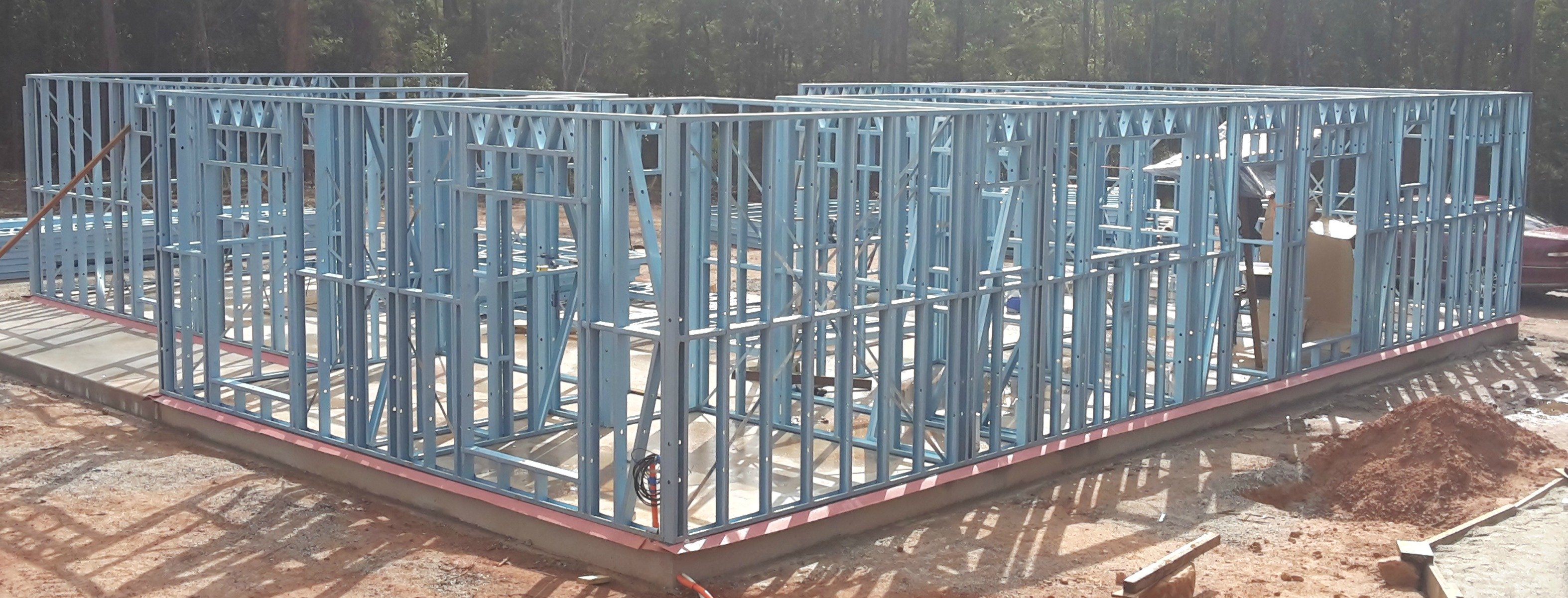 Erected steel kit home wall frames