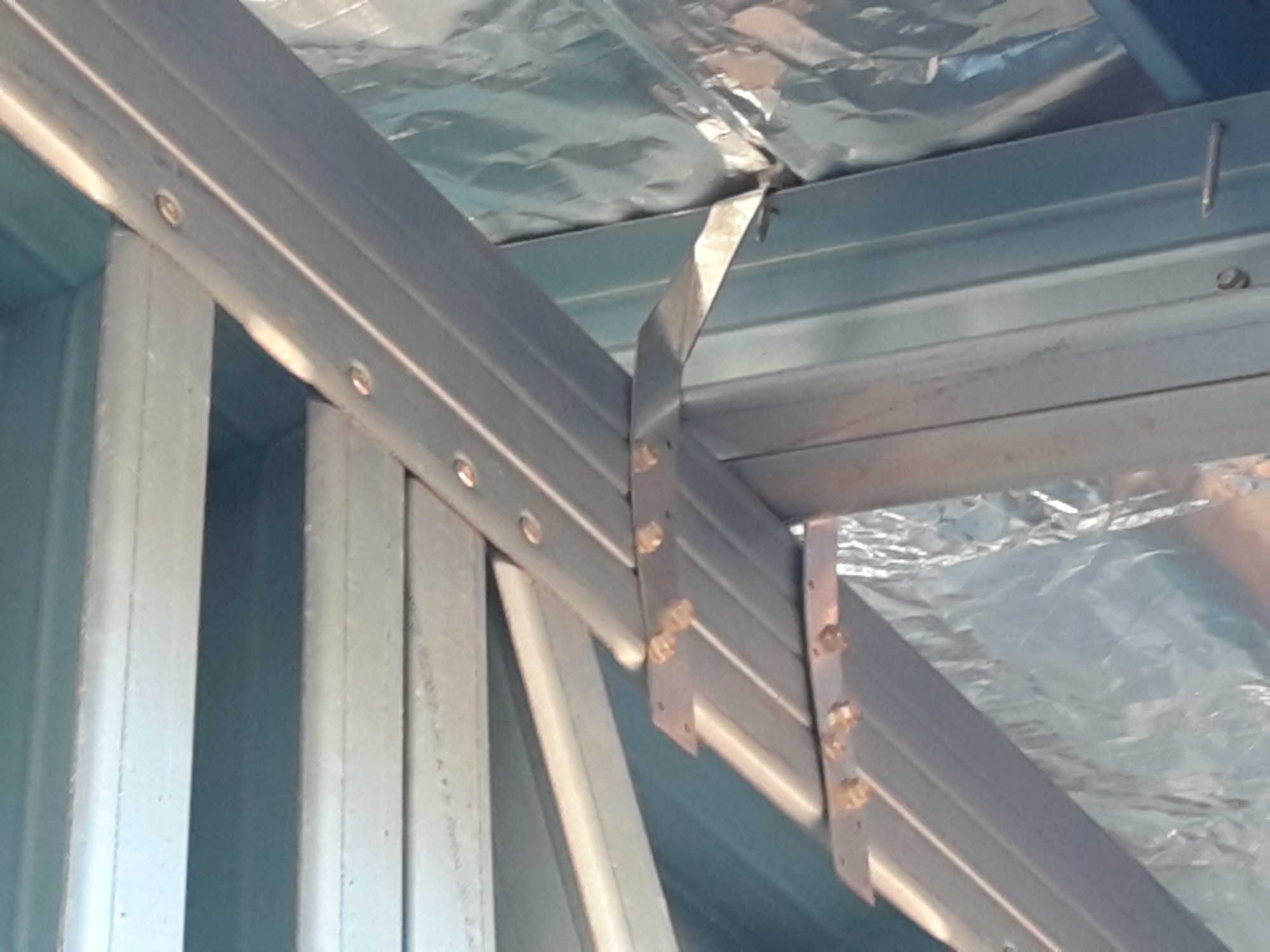Steel frame roof tie down